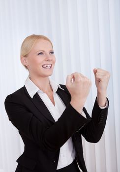 Portrait of cheerful young businesswoman in the office