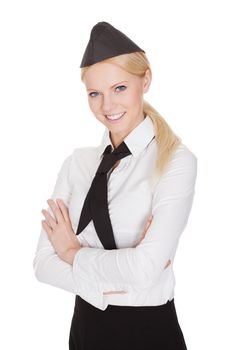 Portrait of beautiful young stewardess. Isolated on white