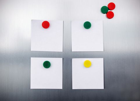 White reminders with magnets on fridge