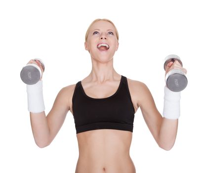 Beautiful young fitness woman doing weight training. Isolated on white