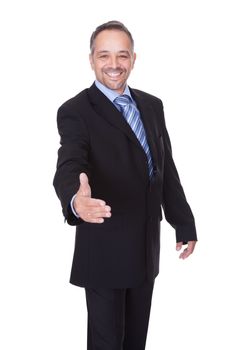 Portrait Of A Businessman Offering Handshake On White Background