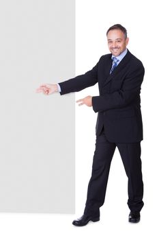 Happy Businessman Holding Blank Billboard On White Background