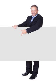 Happy Businessman Holding Blank Billboard On White Background