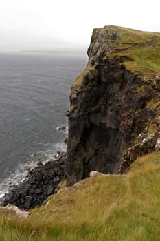 The sheer sea cliff on the island of Oronsay on the west coast of Skye