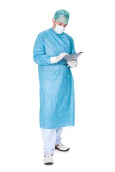 Portrait Of Doctor In Operation Gown Writing On Folder Isolated On White Background