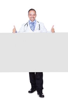 Portrait Of A Doctor Holding Blank Placard Isolated On White Background