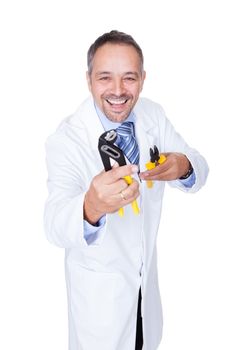 Smiling Male Doctor Holding Pliers On White Background