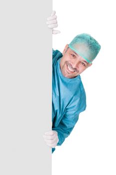 Doctor In Operation Gown Holding Blank Placard On White Background