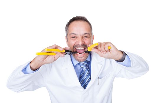 Smiling Male Doctor Holding Pliers On White Background