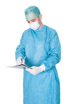Portrait Of Doctor In Operation Gown Writing On Folder Isolated On White Background
