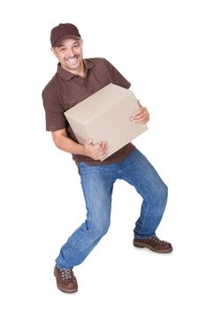 Delivery Man Carrying Heavy Box On White Background