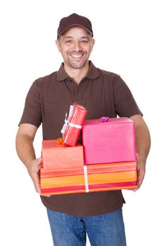 Portrait Of Happy Man Holding Gifts On White Background
