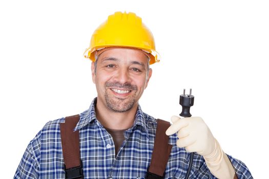 Happy Electrician Holding Wire Plug On White Background