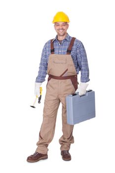 Happy Construction Worker Holding Toolbox On White Background