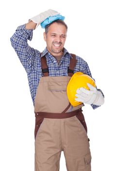 Portrait Of Construction Worker Suffering With Headache On White Background