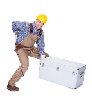 Man With Back Pain Lifting Metal Box Isolated On White Background