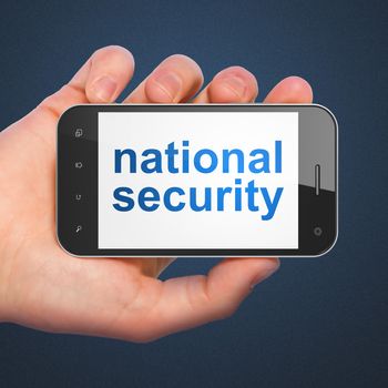 Protection concept: hand holding smartphone with word National Security on display. Mobile smart phone on Blue background, 3d render