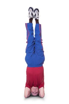 Senior Man Performing Yoga Headstand On White Background