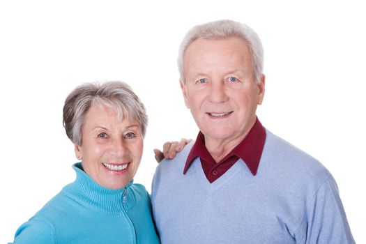 Portrait Of Happy Senior Couple Isolated Over White Background