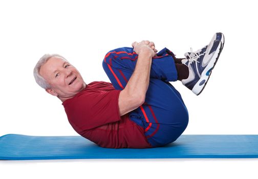Portrait Of Senior Man Exercising On White Background