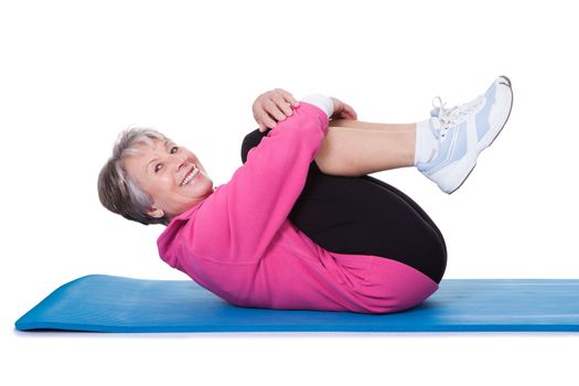 Portrait Of Senior Woman Exercising On White Background