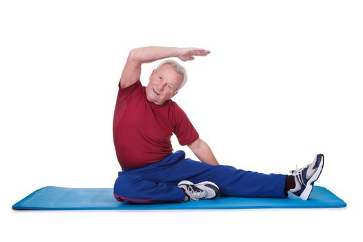 Portrait Of Senior Man Exercising On White Background