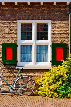 Window with Red Shutters in the Dutch City