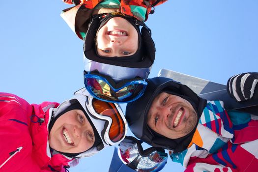 Skiing, winter, snow, skiers, sun and fun - family enjoying winter vacations