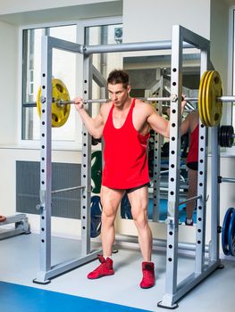 weightlifter squats with a barbell