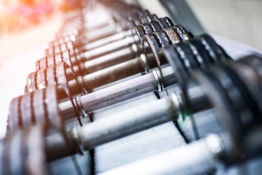 dumbbells in modern sports club. Weight Training Equipment