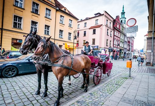 POZNAN, POLAND - AUGUST 21: The central square on August 21, 2013 in Poznan, Poland. Currently, Old Market is the center of tourism Poznan and the most beautiful part of the city.