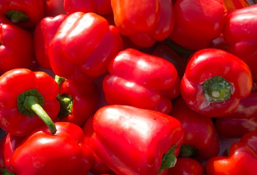 Full frame take of fresh red peppers on a market stall