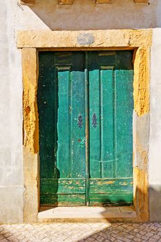 Wooden Door in the Wall of Portuguese Home