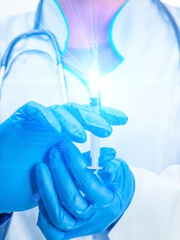 doctor's hands with syringe