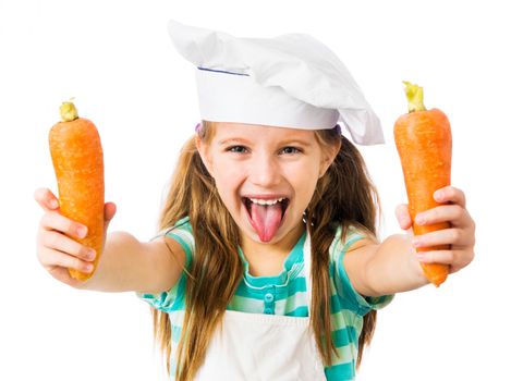 little girl in chef hat with two carrots shows tongue on a white background