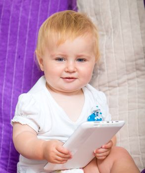 adorable baby with tablet PC