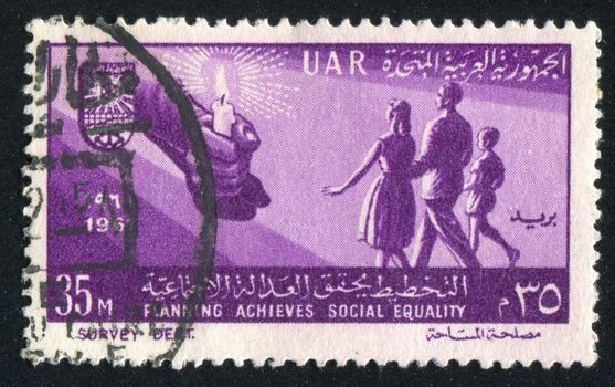 EGYPT - CIRCA 1961: stamp printed by Egypt, shows Hand with candle, family, circa 1961