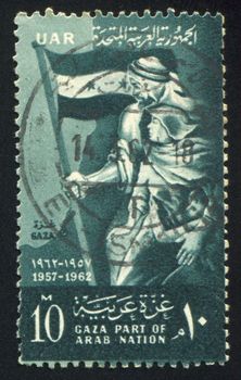 EGYPT - CIRCA 1962: stamp printed by Egypt, shows Man with flag, woman, children, circa 1962