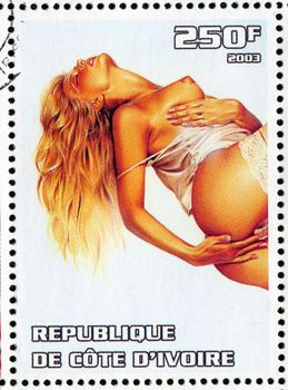 IVORY COAST CIRCA 2003: stamp printed by Ivory Coast, shows sexy woman, circa 2003