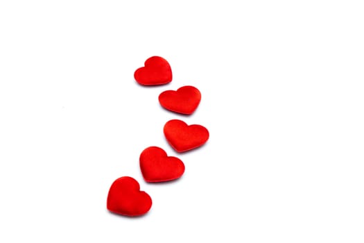 Red hearts on a line on white background