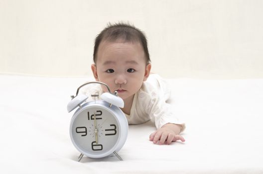 Baby with clock