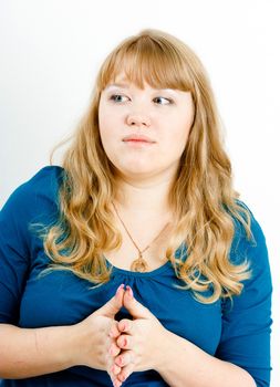portrait of a serious young blond woman with overweight