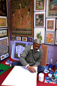 Indian man painting, Udaipur, Rajasthan, India