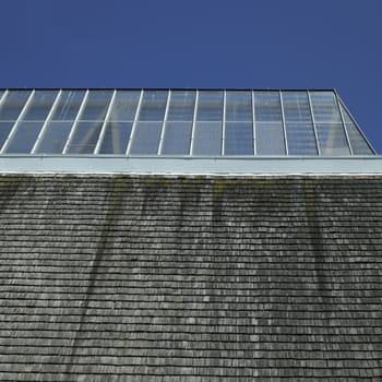 Building with glass roof and shingled wall
