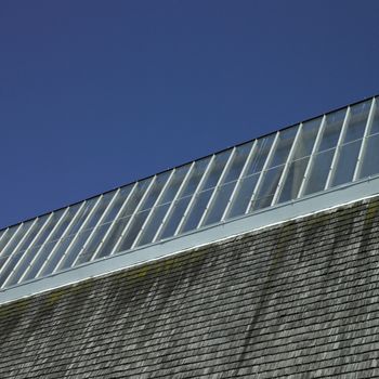 Building with glass roof and shingled wall