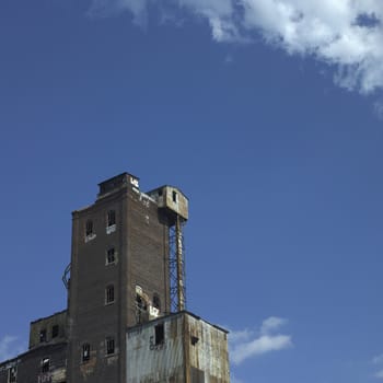 Large abandonned factory made of bricks and metal