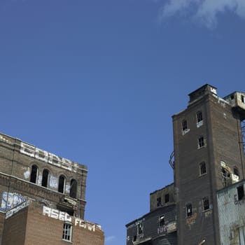 Large abandonned factory made of bricks and metal