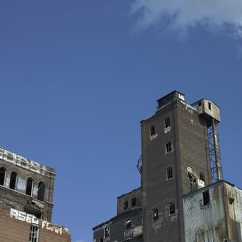 Large abandonned factory made of bricks and metal