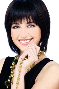 Happy woman black dressed with necklaces, isolated on white