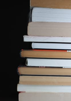 Pile of books at dark background